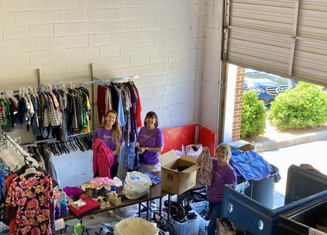 Volunteers sorting clothing donations.