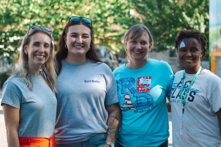 Friends board members with volunteer coordinator and volunteer at Bookmobile Bash 2026